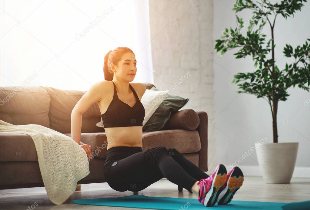 young woman doing fitness and sports at home   