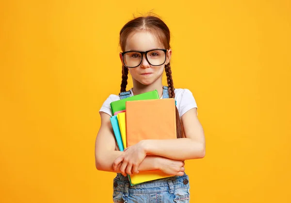 Funny child school girl girl on yellow background — Stock Photo, Image