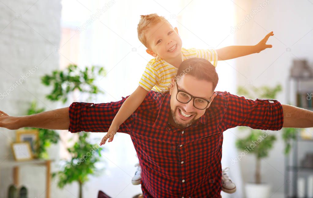 Father's day. Happy family son hugs his dad 