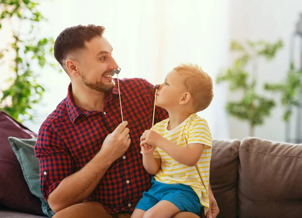 Father's day. Happy funny family son and dad with mustache — Stock Photo, Image