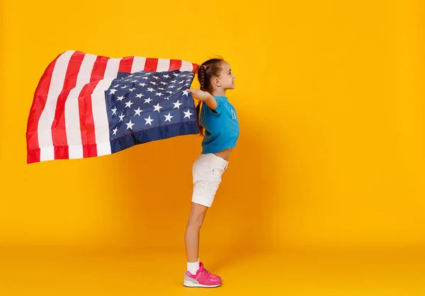 Happy child girl with flag of   United States of America USA on — Stock Photo, Image