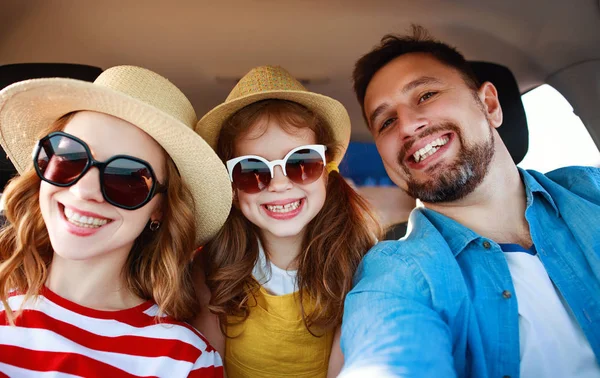 happy   family  in summer auto journey travel by car on beac