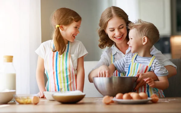 Happy family funny kids bake cookies in kitchen. — Stock Photo, Image