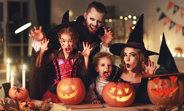 Happy family mother father and children in costumes and makeup o — Stock Photo, Image