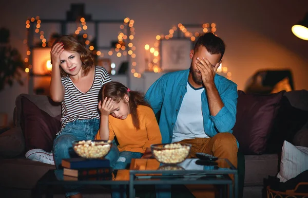 Family mother father and child daughter watching projector, TV, — Stock Photo, Image