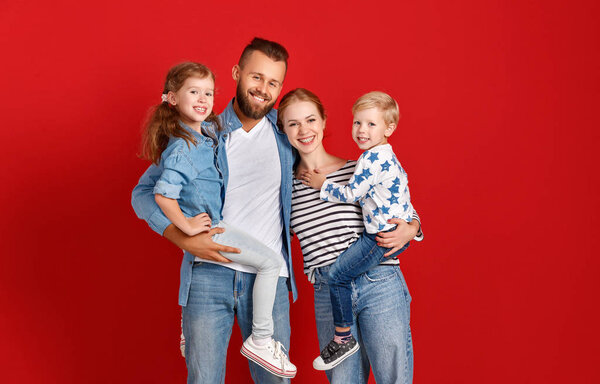 happy family mother father and children daughter and son  near a