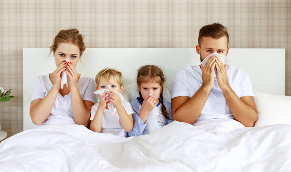 colds and viral diseases. family with runny nose and fever in be