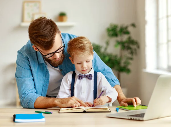 Smart Little Boy Writing Copybook Explaining Study Task While Focused — Stock Photo, Image