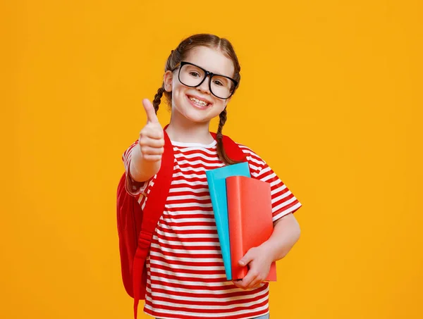 Positive Smart Girl Glasses Textbooks Smiling Camera Gesturing Thumb School — Stock Photo, Image