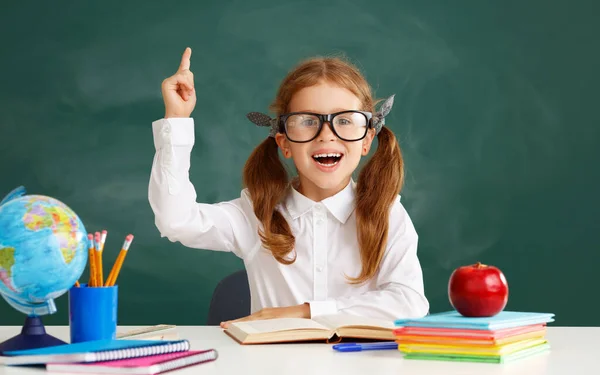 Funny Happy Child Schoolgirl Student Sitting Table Raises His Hand — Stock Photo, Image