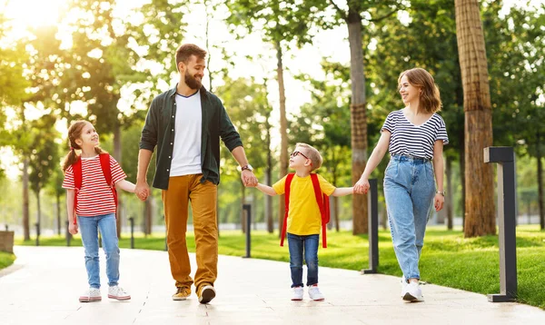 Cheerful Parents Delighted Kids Backpacks Holding Hands Smiling While Walking — Stock Photo, Image