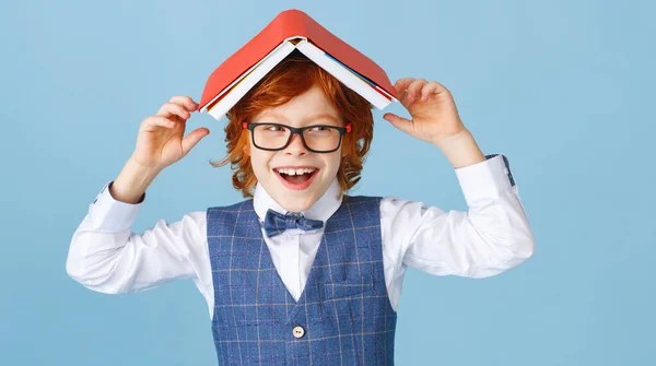 Delighted Boy Glasses Smiling Camera Putting Book Head While Having — Stock Photo, Image