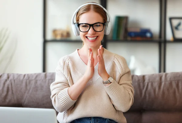 Cheerful Adult Female Headphones Glasses Laughing Clapping Hands While Sitting — ストック写真