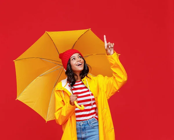 Cheerful Ethnic Woman Yellow Umbrella Smiling Pointing Rainy Day Red — Stock Photo, Image