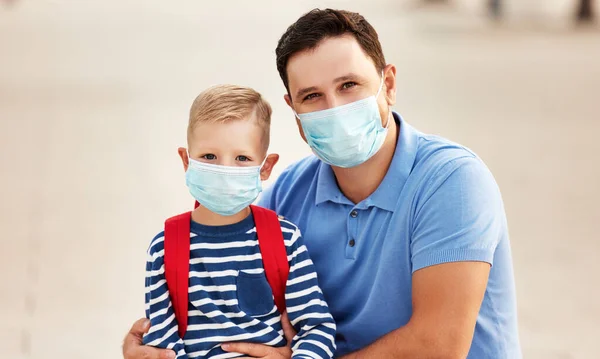 Positive Adult Dad Little Schoolboy Medical Masks Coronavirus Prevention Looking — Stock Photo, Image