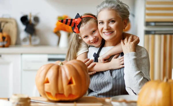 Cheerful Girl Hugging Elderly Woman Smiling Camera While Carving Jack — Stock Photo, Image