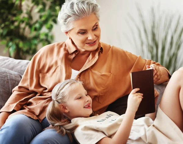 Happy Elderly Woman Little Girl Smiling Looking Each Other While — Stock Photo, Image