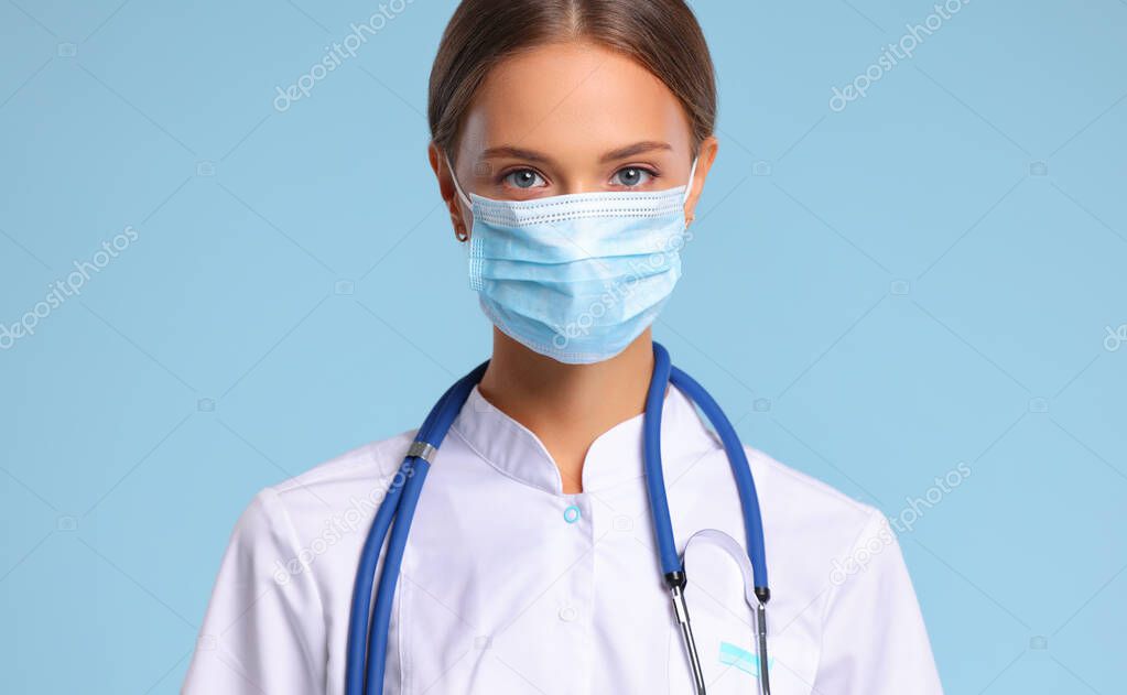 concept of fighting and prevention coronavirus infection covid 19. happy woman doctor in the protective medical  mask 