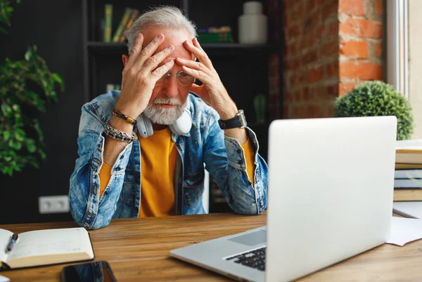 Exhausted Senior Man Stylish Outfit Rubbing Temples Thinking While Sitting — Stock Photo, Image