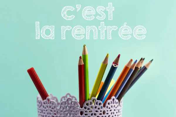 Concept back to school translated in french with Coloured pencils and