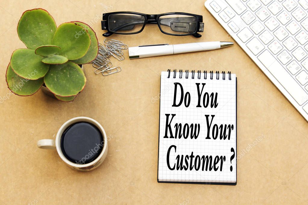 do you know your customer concept, desktop: notebook and cup coffee, pen, eyeglasses, keyboard ...