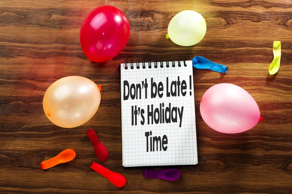 don't be late its party on notebook and colorful ballons with neon light for christmas holiday
