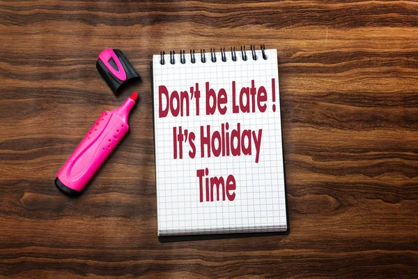 don\'t be late its party  text concept in notebook on wood table with pink felt pen