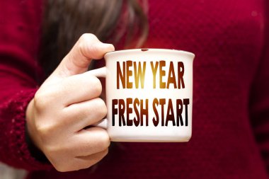 Hands Holding a Coffee Mug With Text Yeni Yıl Taze Başlangıç