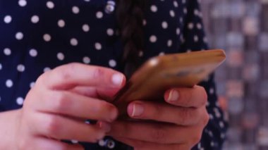 closeup woman texting, using smartphone