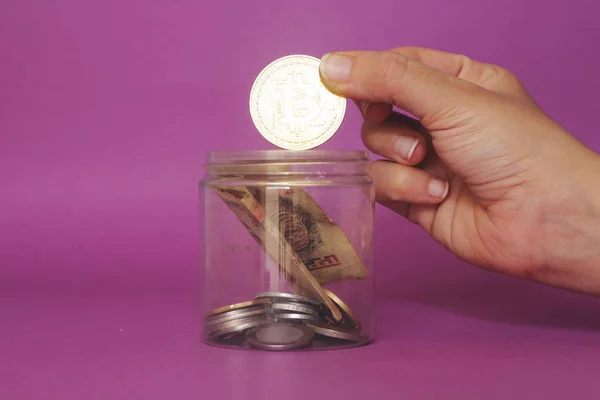 Closeup Hand Saving Bitcoin Plastic Pot — Stock Photo, Image