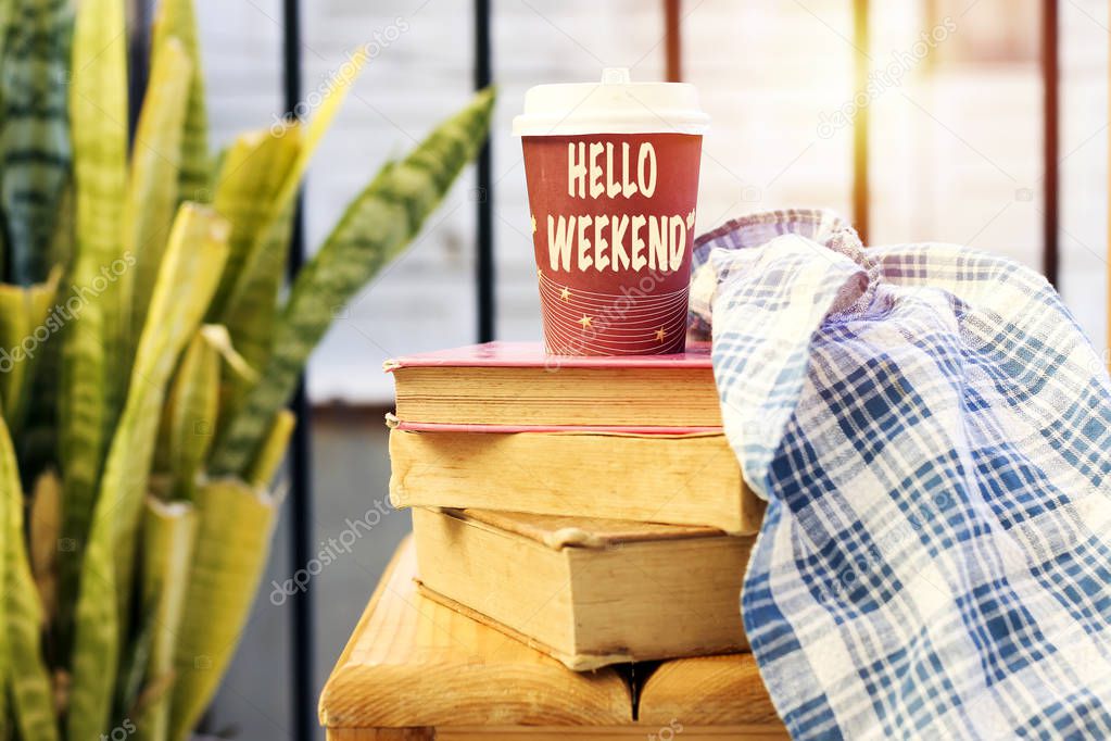 hello weekend concept, coffee cup and books