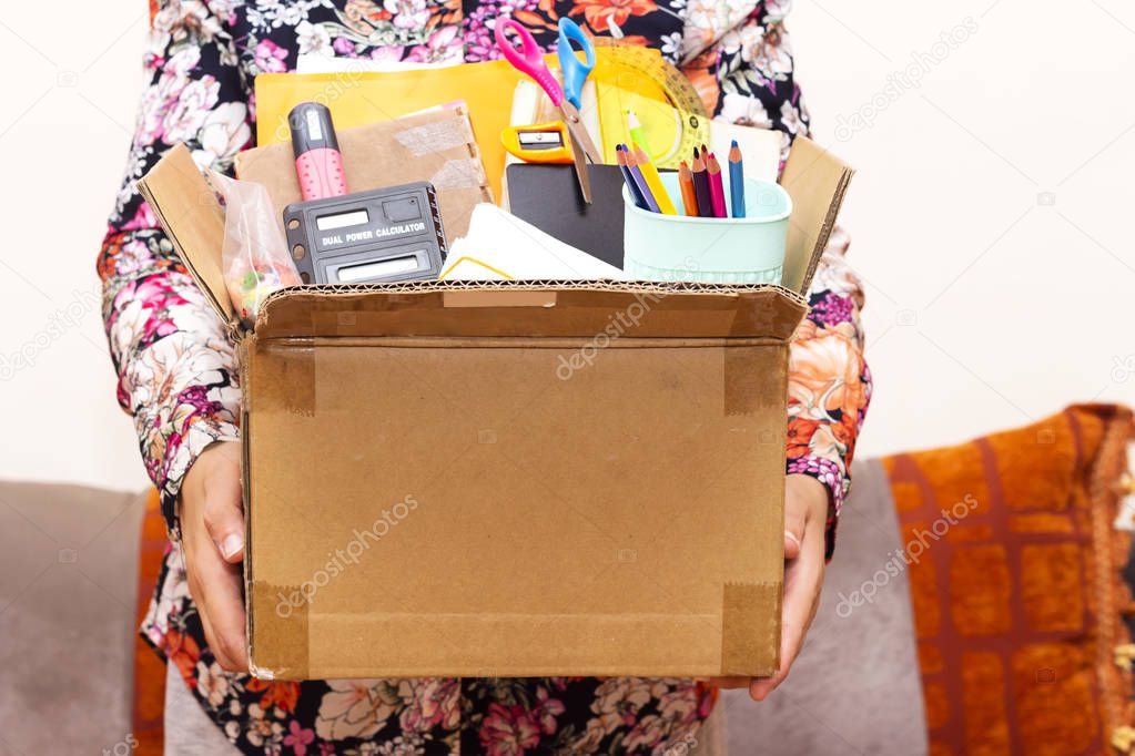closeup woman holding tools of school for donation or back to school concept 