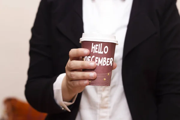 hello December on disposable cup coffee