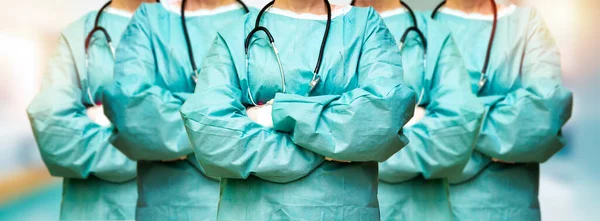 group of women\'s surgeon doctor with crossed arms in the clinic