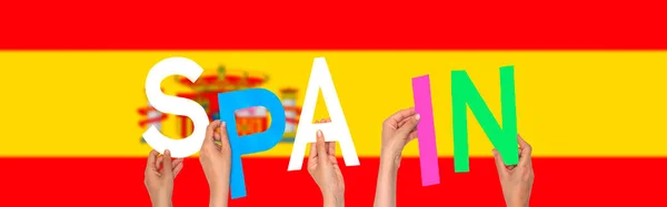 Manos Formando España Texto Con Fondo Bandera — Foto de Stock