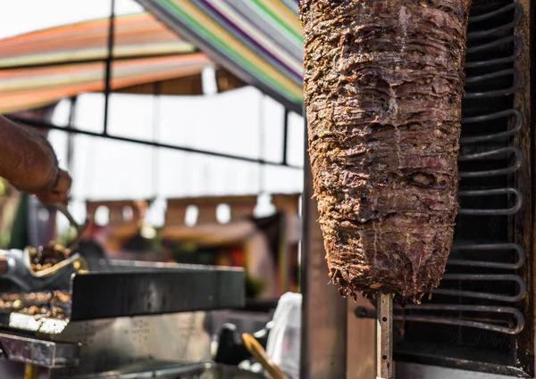 Chef preparing kebab and grill shawarma meat at a street food market