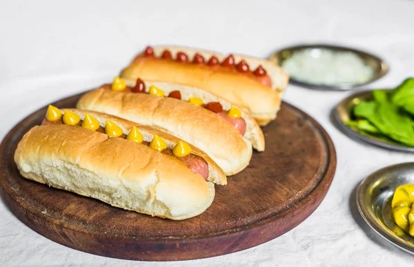Selection of classic hot dogs against white background — Stock Photo, Image