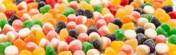 Tatlı tatlı renkli gummi jöle şeker çeşitleri. Gıda arka plan deseni — Stok fotoğraf