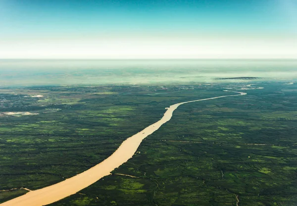 Landscape aerial view of colorful Amazon rivers, forest, jungle, and fields