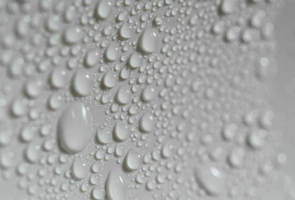 Gotas de agua en una superficie plástica, macrofotografía . —  Fotos de Stock