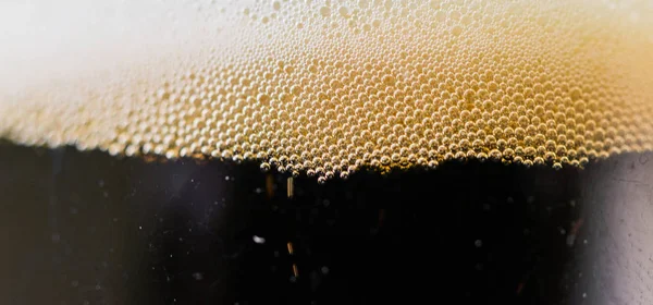 Beer and foam bubbles colorful food and drink background.