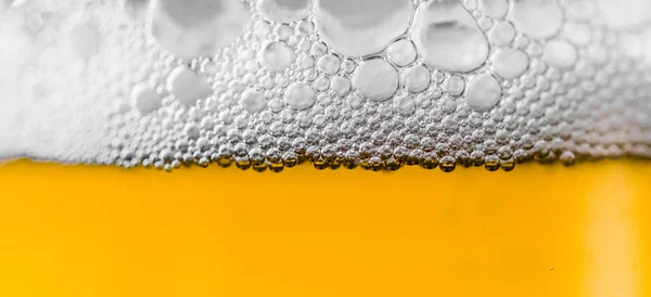 Beer and foam bubbles colorful food and drink background.