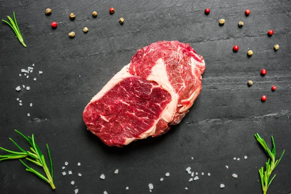 Colorful steak meat from angus wagyu beef against black background.