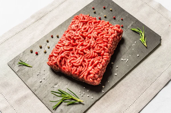 Colorful mince meat from angus wagyu beef against black background.