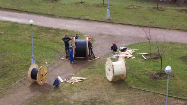 Installation of power cable by workers — Stock Video