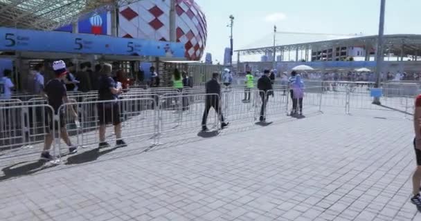 Volunteers in front of football — Stock Video