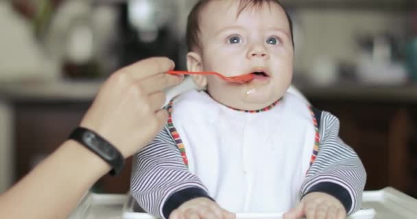 Child boy is naughty at the table — Stock Video