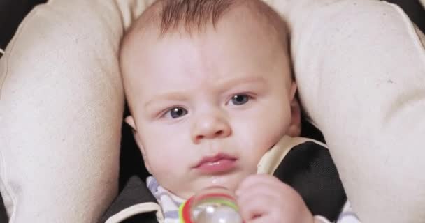 Baby boy in a rocking cradle — Stock Video