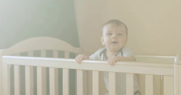 Baby boy in a crib — Stock Video