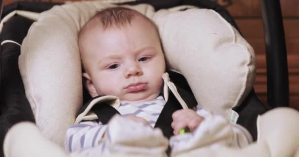 Baby boy in a rocking cradle — Stock Video